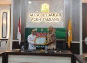 Bupati Aceh Tamiang Terima Penghargaan Pembentukan Posbankumdes 100 Persen